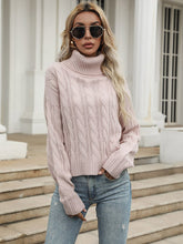 Pull rose à col montant