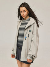 Manteau gris à capuche zippée