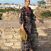 Robe bohème brodée à col V profond, dos nu et manches longues