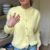 Gilet en maille bouffant à boutons ouverts sur le devant