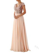 Robe de demoiselle d'honneur à col en V et empiècements en mousseline à sequins