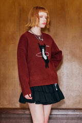 Pull en maille avec chat dansant