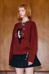 Pull en maille avec chat dansant
