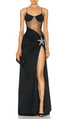 Robe longue noire à corsage en résille orné d'étoiles de mer