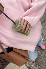 Pull rose à col rond et coupe ample