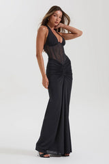 Robe de soirée longue crayon dos nu à empiècements en résille