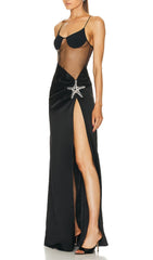 Robe longue noire à corsage en résille orné d'étoiles de mer