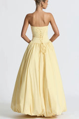 Robe de soirée jaune bustier asymétrique à nouer