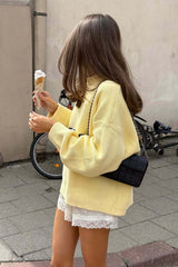 Pull jaune rétro ample à imprimé lettres