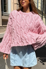 Pull court rose à torsades ample