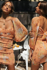 Robe à manches lanternes et dos nu