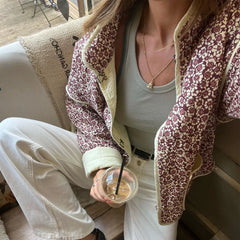 Gilet matelassé à col montant et imprimé floral
