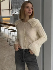Manteau court à manches évasées plissées