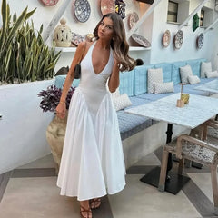 Robe longue dos nu à décolleté plongeant et col halter
