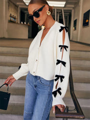 Manteau en maille côtelée ajourée à nœud