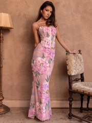 Robe de vacances rose à fleurs et fines bretelles spaghetti