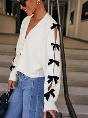 Manteau en maille côtelée ajourée à nœud