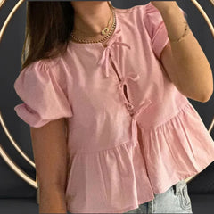 Blouse élégante à manches bouffantes et péplum