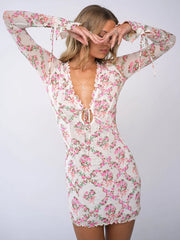 Robe mini moulante à volants floraux et col en V