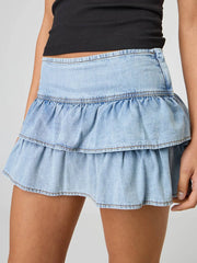 Jupe mini trapèze à volants en denim délavé