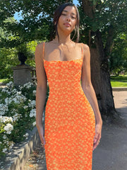 Robe midi moulante dos nu à bretelles fleuries