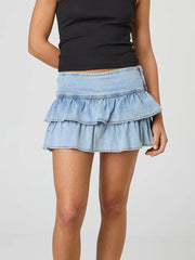 Jupe mini trapèze à volants en denim délavé