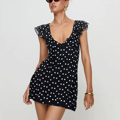Robe mini moulante à pois et col en V