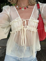 Chemisier beige transparent à lacets