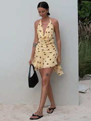 Robe mini en mousseline à pois et dos nu