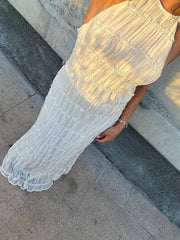 Robe longue dos nu froncée à volants