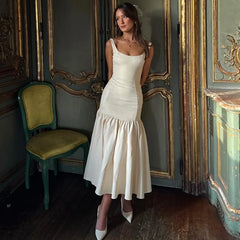 Robe longue portefeuille décolletée et fendue sur les hanches