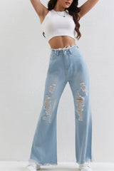 Jean slim évasé bleu délavé à ourlet brut et patchwork déchiré