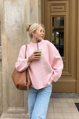 Pull rose à col rond et coupe ample
