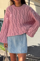 Pull court rose à torsades ample