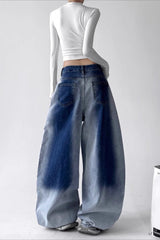 Jean vintage taille haute, jambes larges, délavage dégradé et coupe cintrée